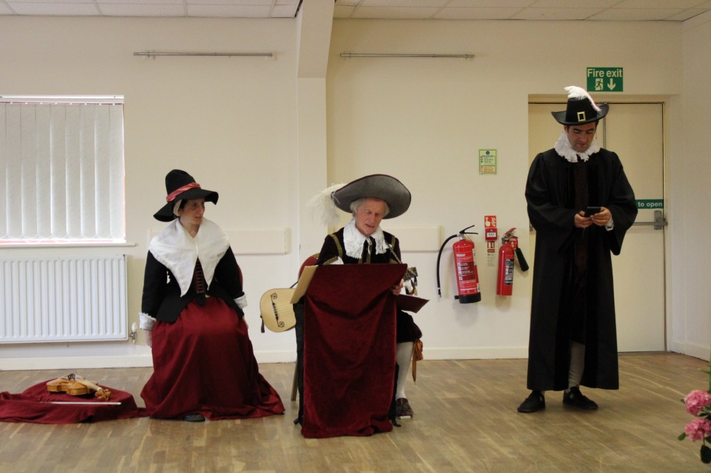 Two men and a woman in early modern costume