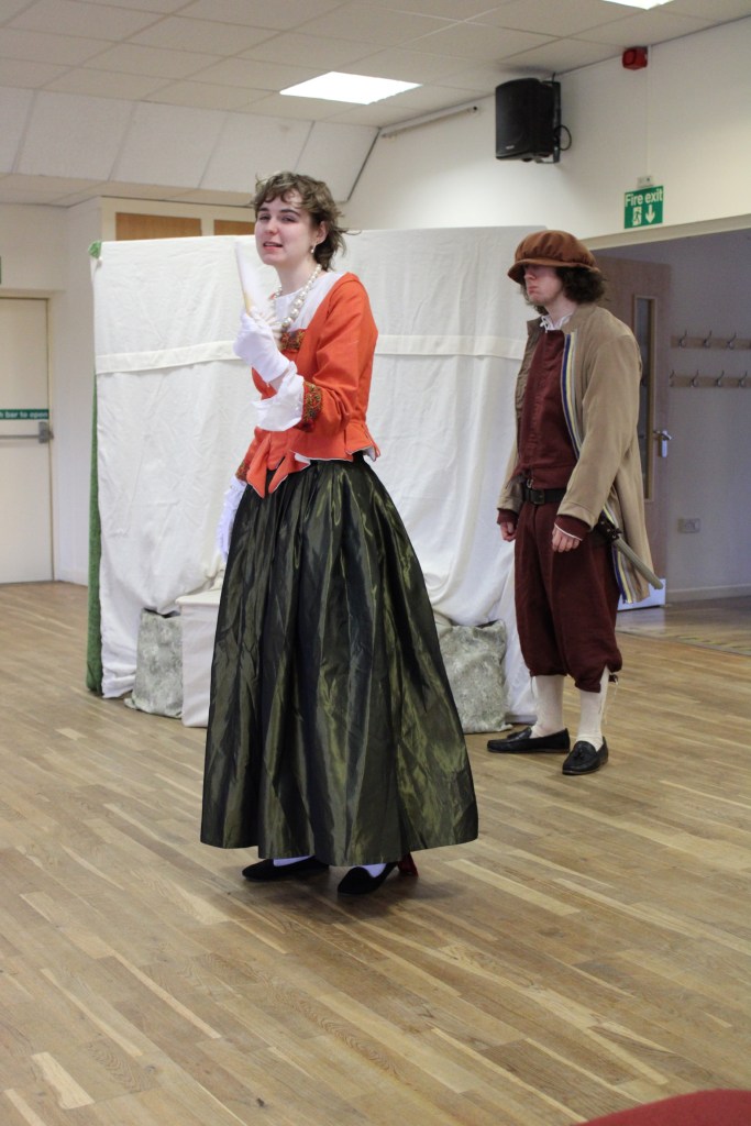 A woman and a man in early modern costume