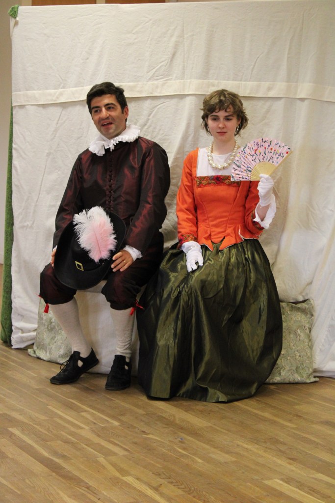 A man and a woman sitting on a seat