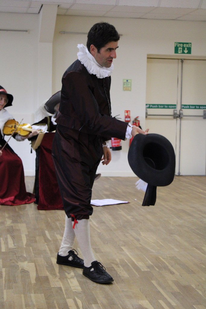A man raising his hat