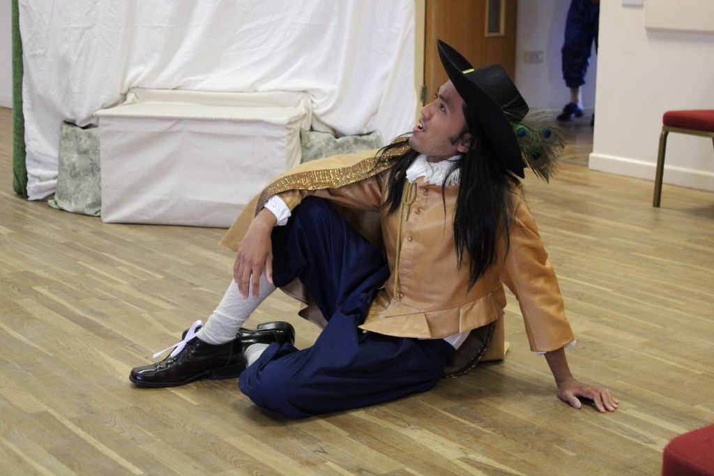 A man sitting on the floor looking upwards