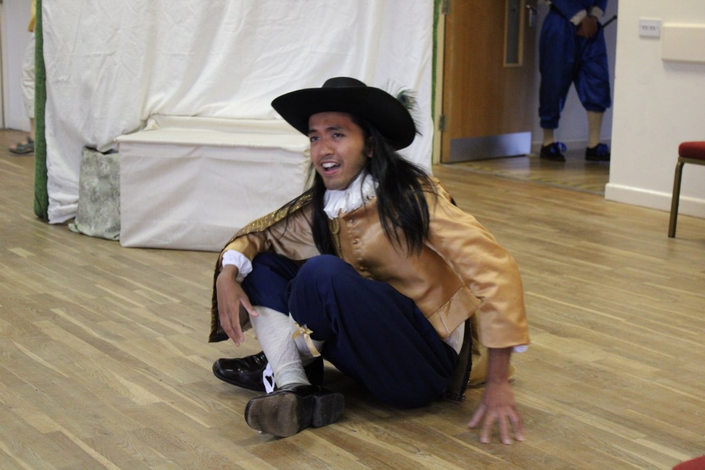 A man sitting cross-legged on the floor