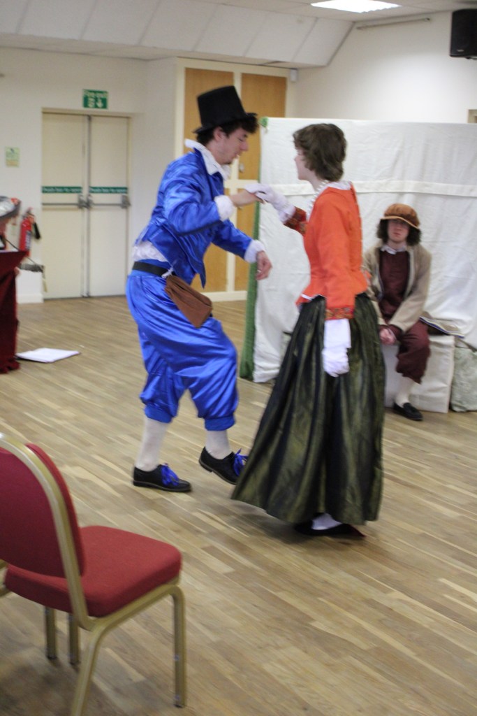 A man hopping, holding hands with a woman