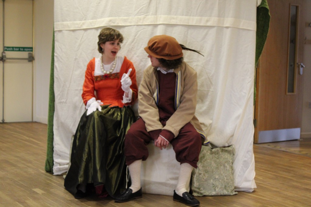 A woman and a man sitting on a seat