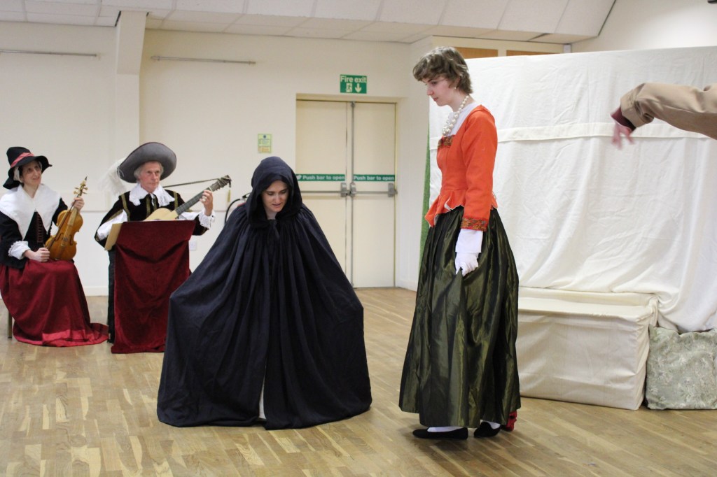 A woman curtseying to another woman