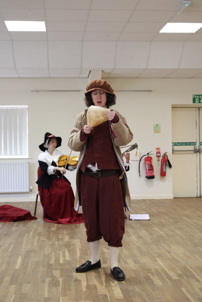 A man reading a letter aloud