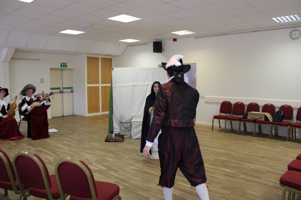 A woman facing a man