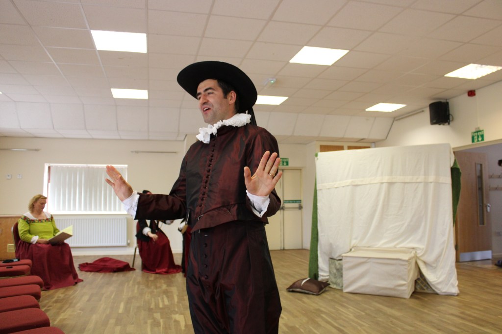 A man with hands raised