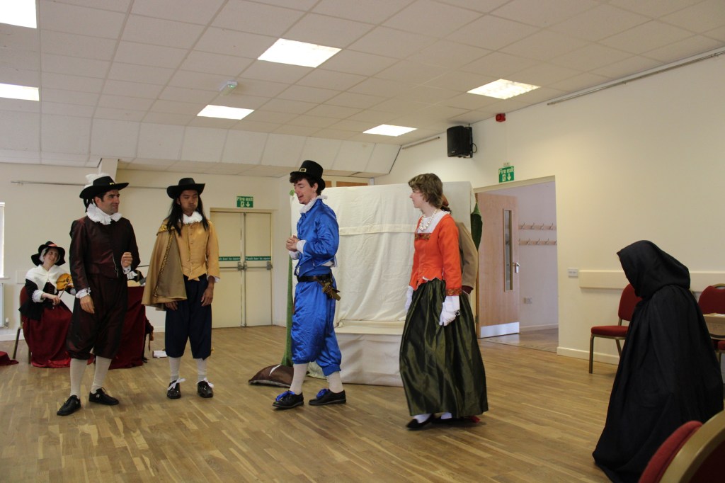A group of people in early modern costume