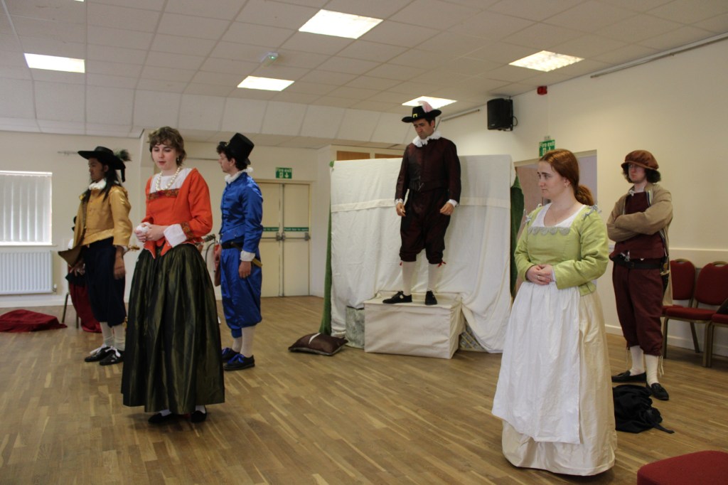 A group of people in early modern costume