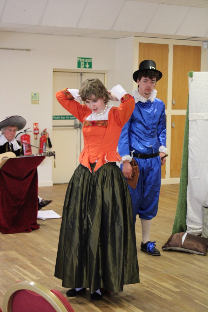 A woman taking off her pearl necklace