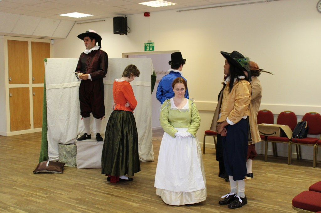 A group of people, two of whom are leaving