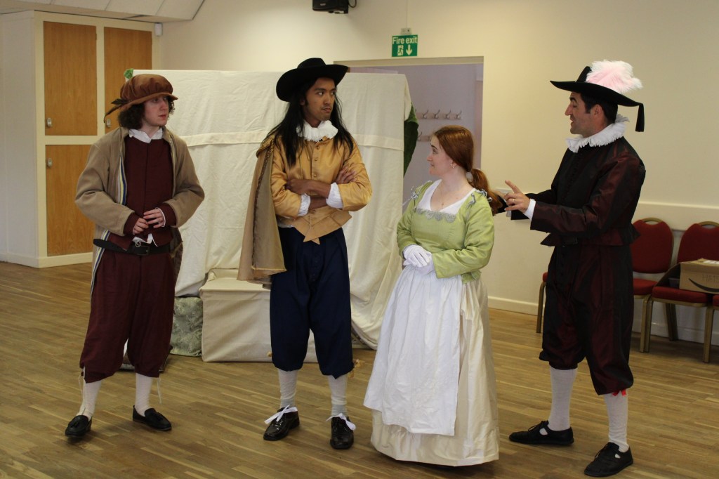 Three men and a woman in early modern costume