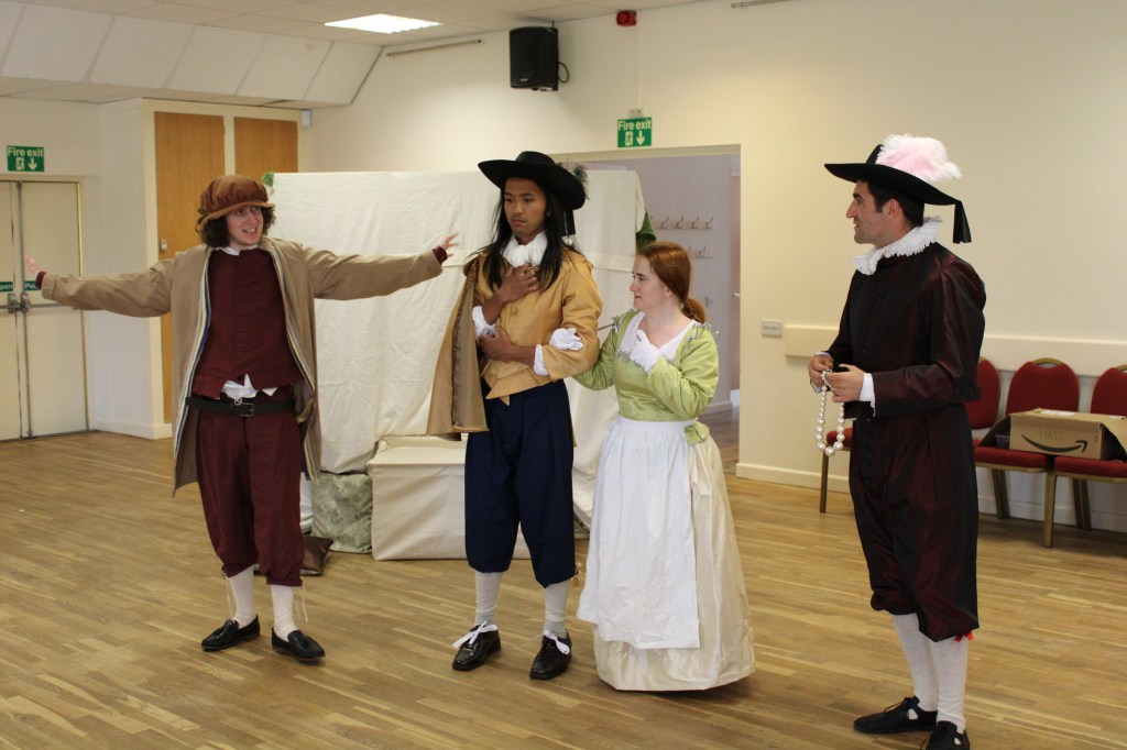 A group of people in early modern costume
